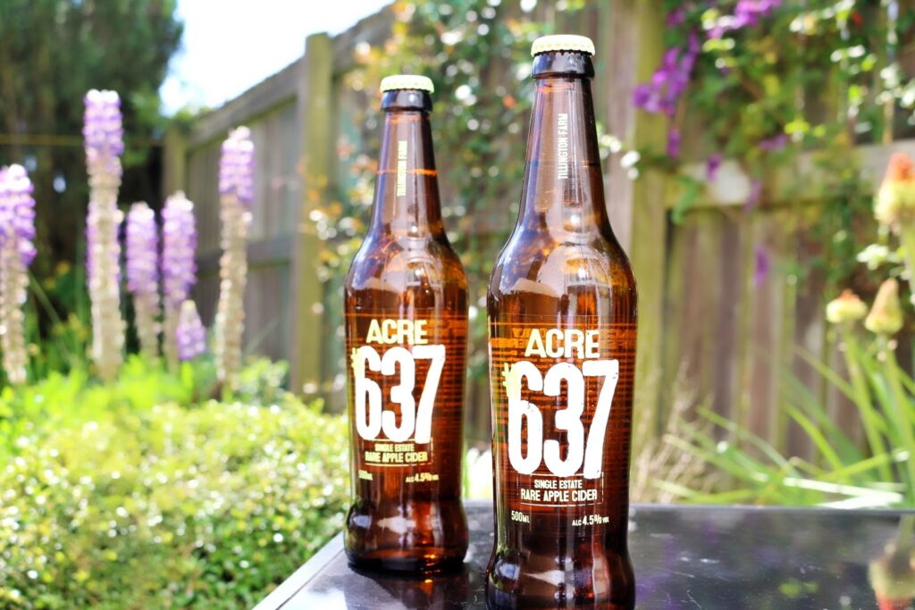 Close up photo of two ACRE 637 Rare Apple Cider bottles