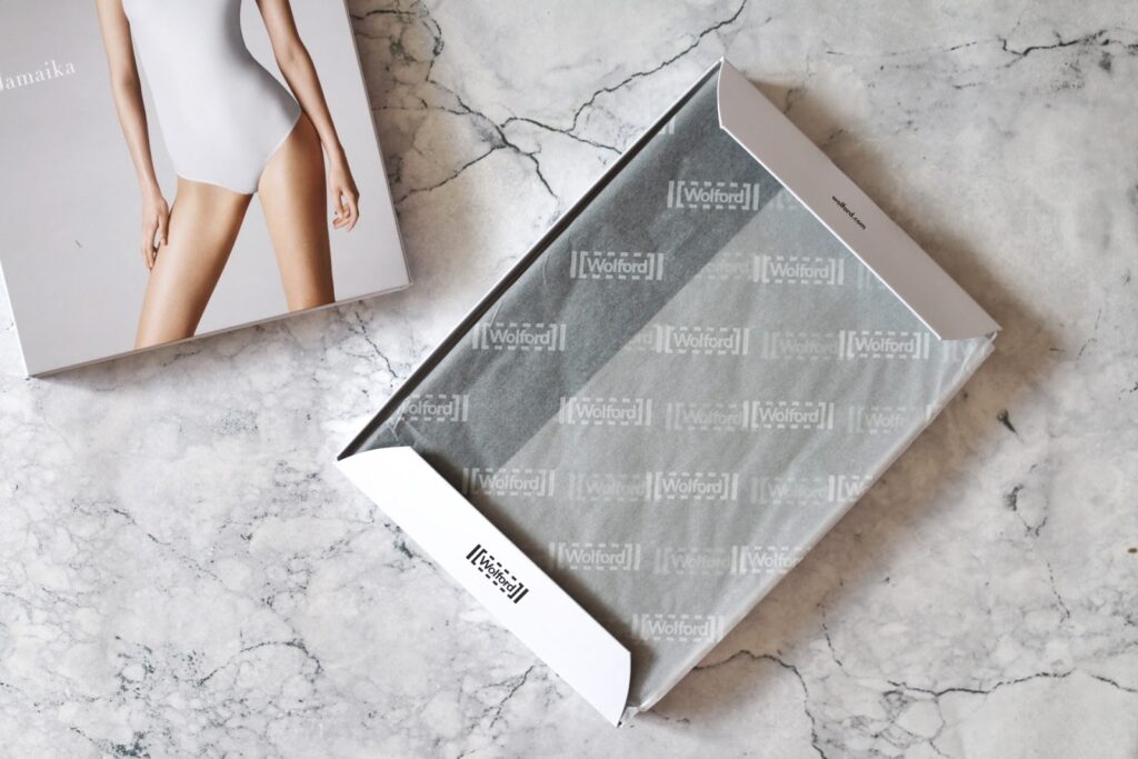 Wolford Jamaika String Body Review on Thelifeofaglasgowgirl.co.uk Birds eye view of the Wolford Jamaika String Body in the box on a marble background