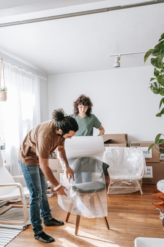 7 Top Tips For Moving House - Stock photo from pexels by Blue Bird of a Couple Packing up a chair