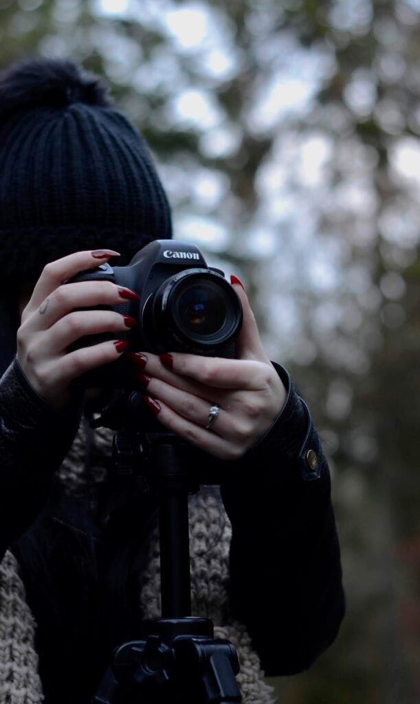 Close up photo of Jordanne holding a canon camera