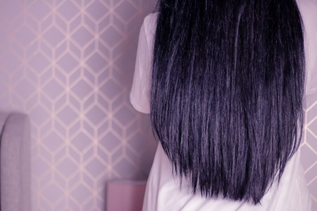 A photo of Jordanne with tail bone length black hair