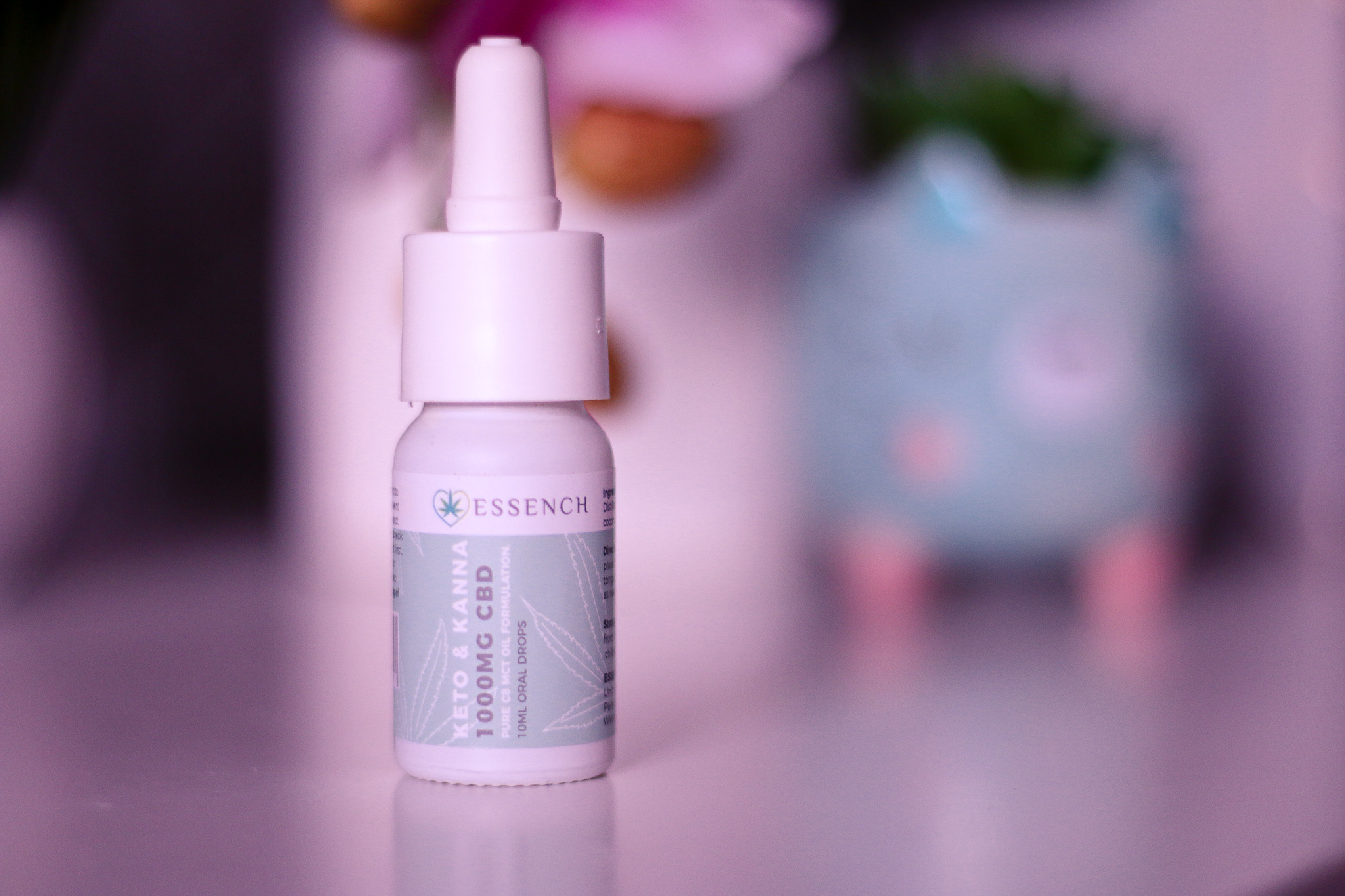 National Women's Health and Fitness day with ESSENCH A close up photo of the Keto and Kanna 1000MG CBD oil from ESSENCH