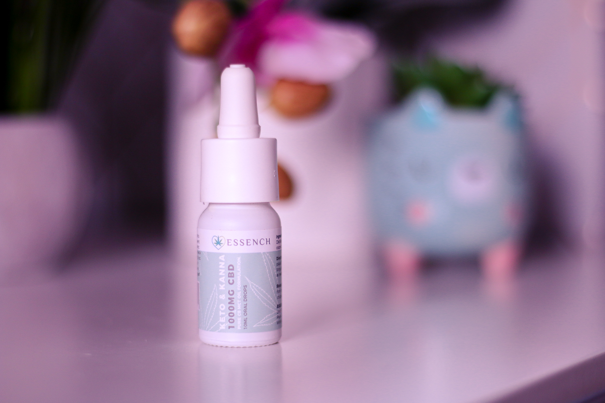 National Women's Health and Fitness day with ESSENCH Close up photo of the Keto and Kanna 1000MG CBD oil from ESSENCH