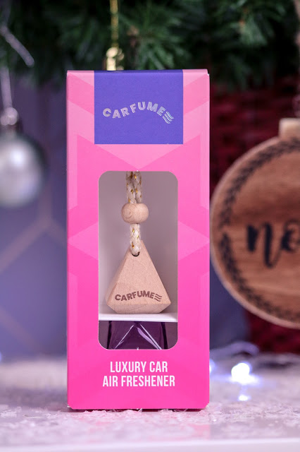 Close up of the Pink Carfume car air freshener