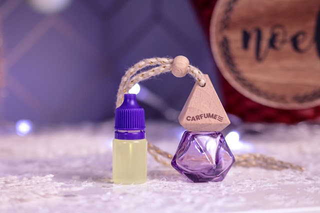 Close up of the Pink Carfume car air freshener