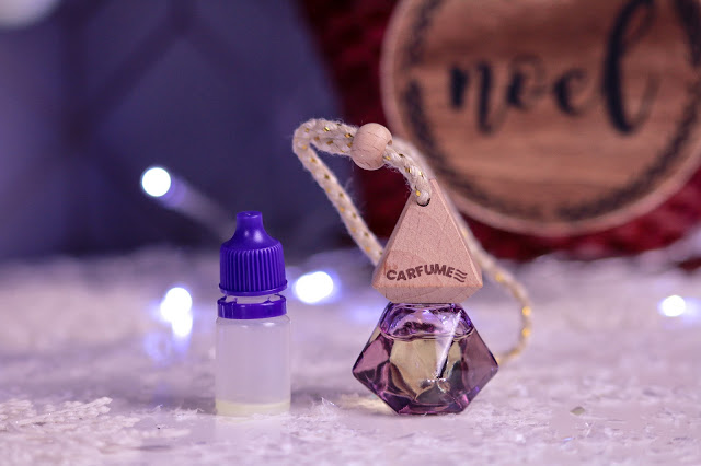 Close up of the Pink Carfume car air freshener