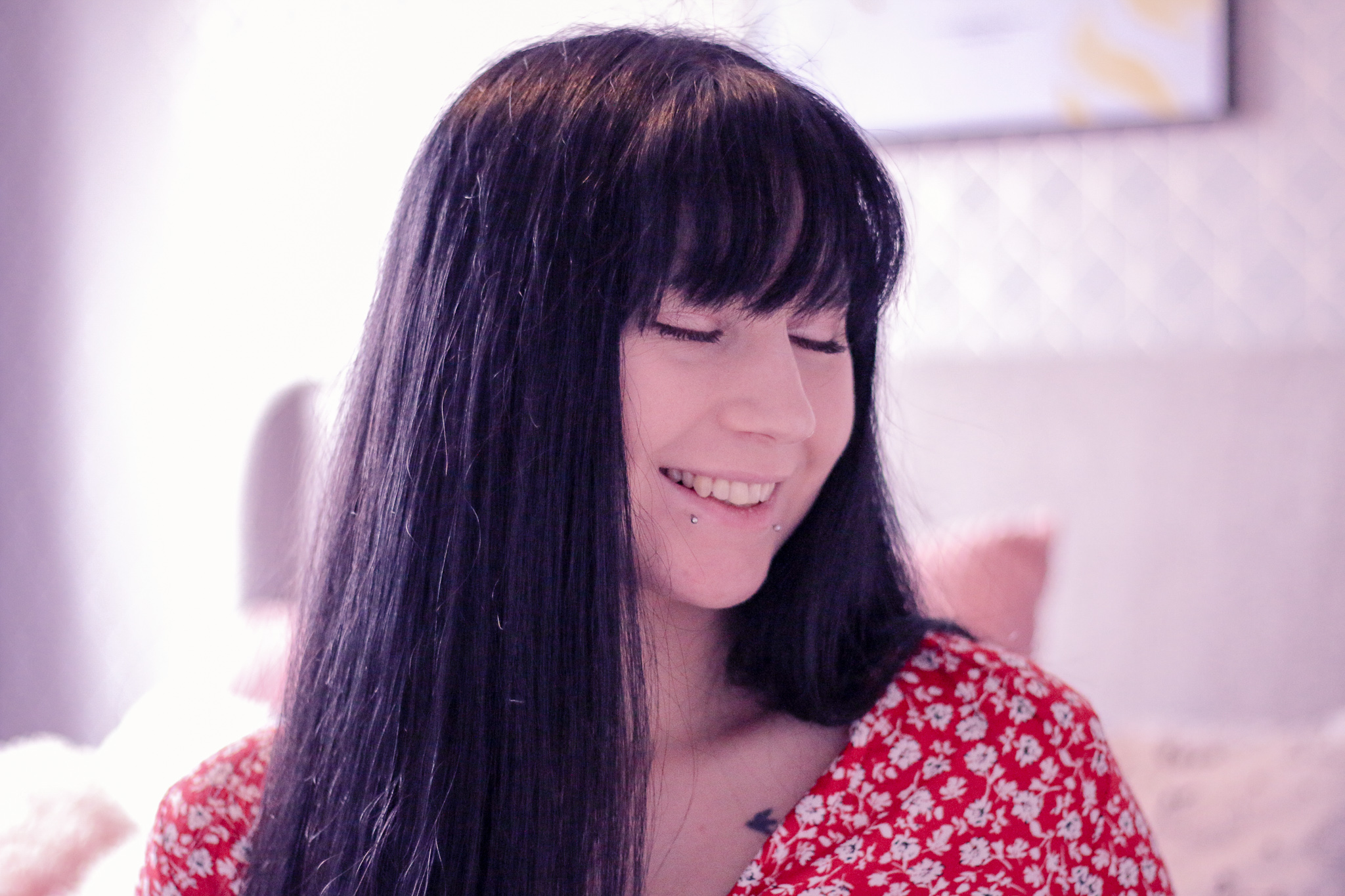Photo of Jordanne from Thelifeofaglasgowgirl.co.uk A close up photo of Ofaglasgowgirls face, she has long black hair with a fringe and is smiling wearing a red dress