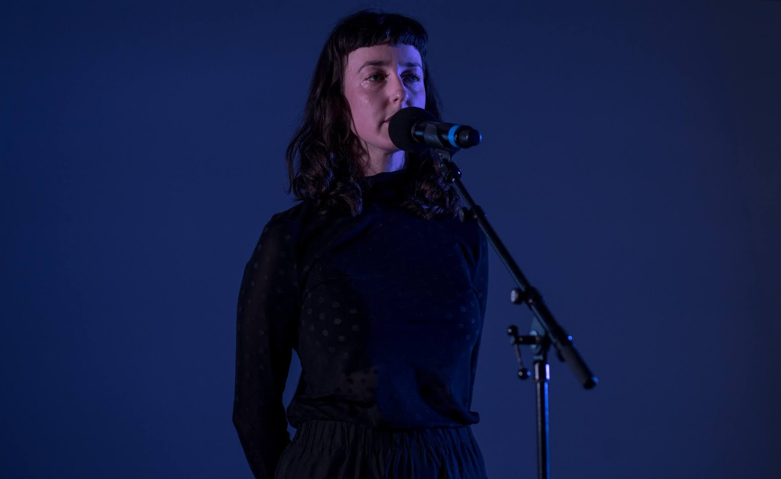 Photo if a woman performing at the Just start here festival by National theatre - Photo by Jordanne lee creative Photo if a woman performing on stage at the Just start here festival by National theatre 2020 - Photo by Jordanne lee creative