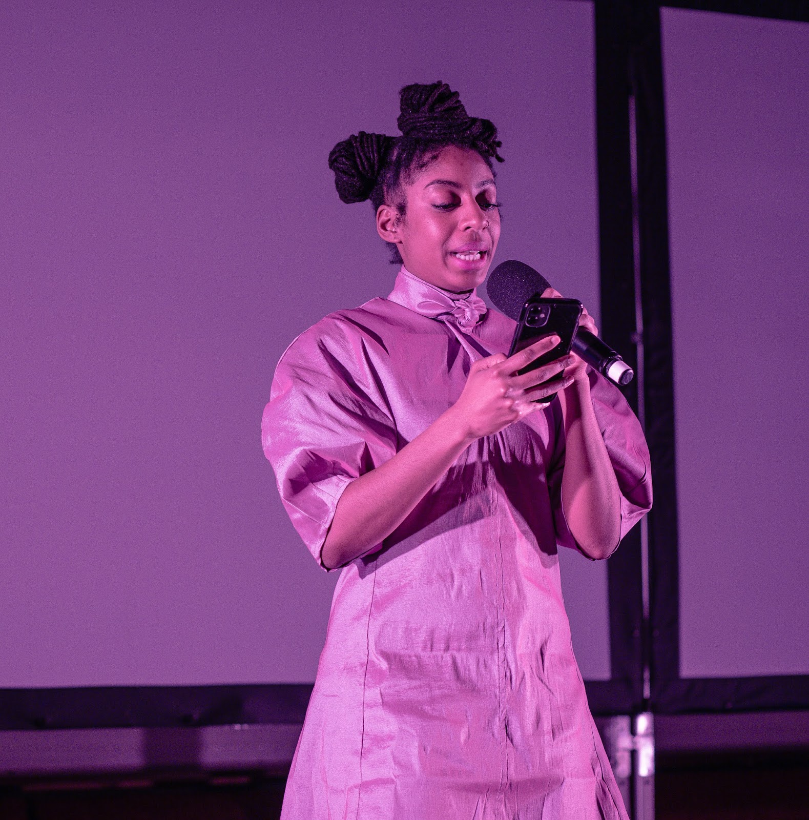 Imposter Syndrome Photo if a woman performing on stage at the Just start here festival by National theatre 2020 - Photo by Jordanne lee creative