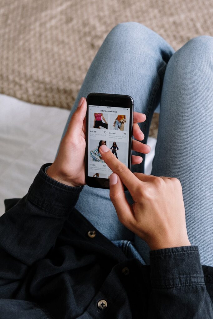 Stock photo of someone online shopping on a phone from Pexels by Cottonbro