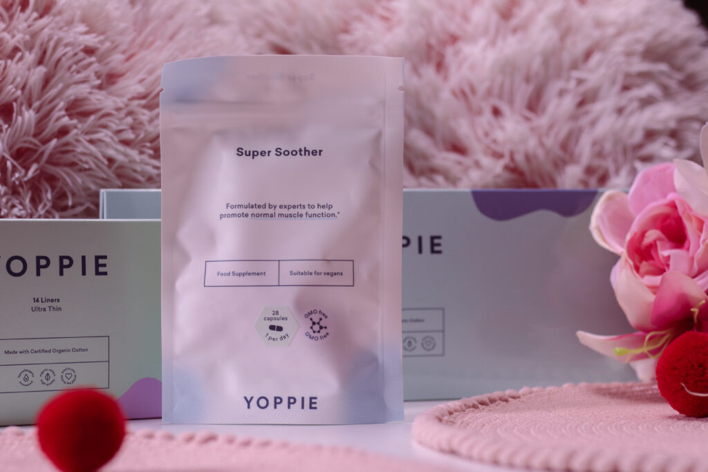 Close up photo of Yoppie box of 8 night pads and 14 liners and Super Soother capsules