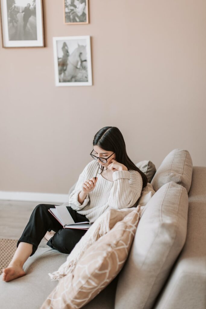 7 Money Saving Tips - Stock photo from Pexels of a woman and a diary by Vlada Karpovich