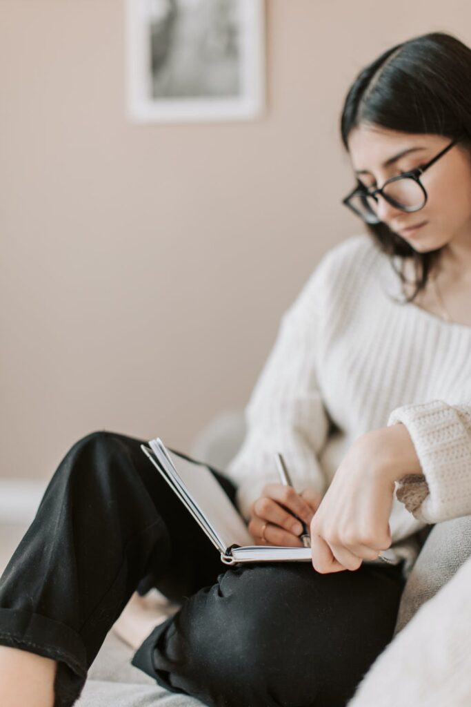 Blog Post Ideas - stock photo of woman with diary from pexels by Vlada Karpovich