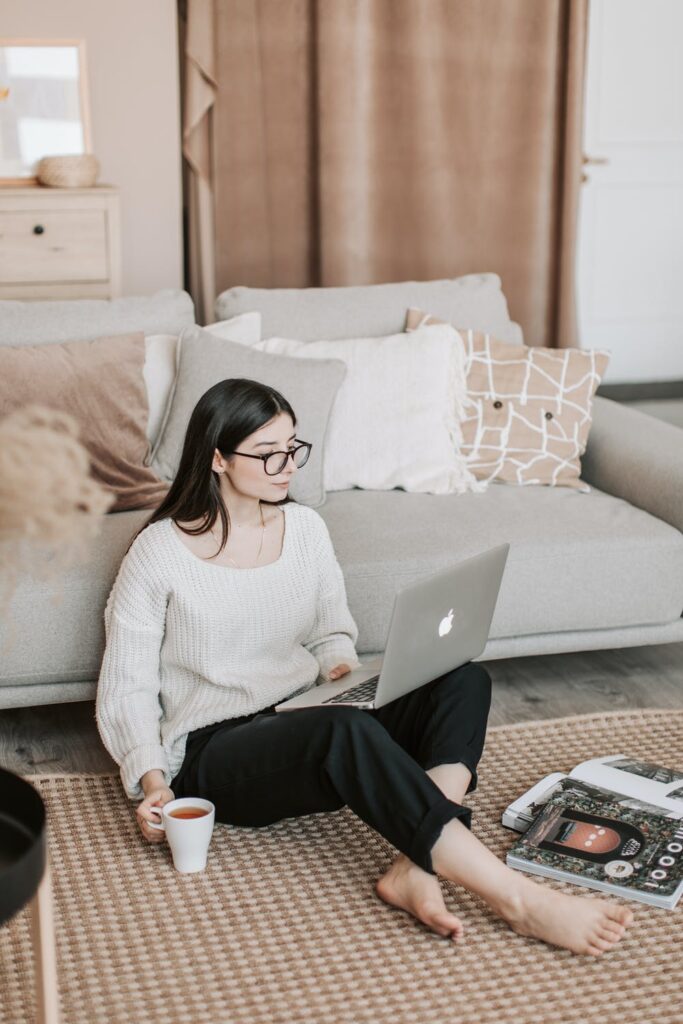 Blog Post Ideas - stock photo of woman at laptop on floor from pexels by Vlada Karpovich