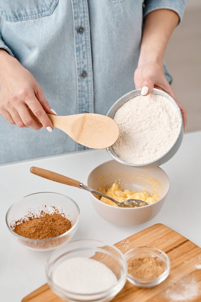Blog post ideas - stock photo of a woman baking by Nicole Michalou on pexels