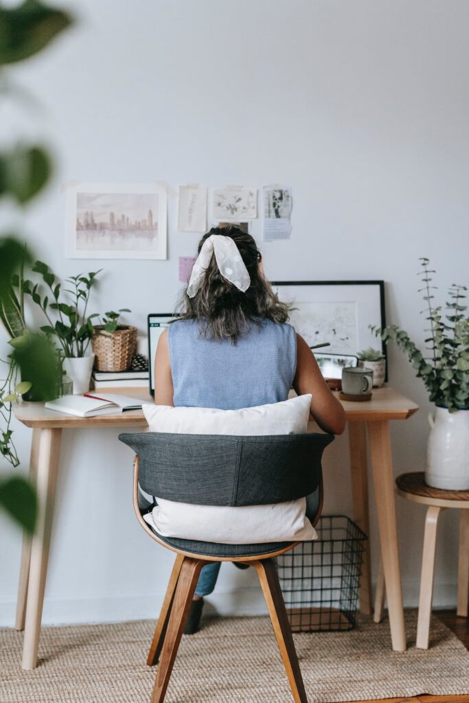 List of blog post ideas - Stock photo of a woman sitting at a table by Teona Swift on Pexels