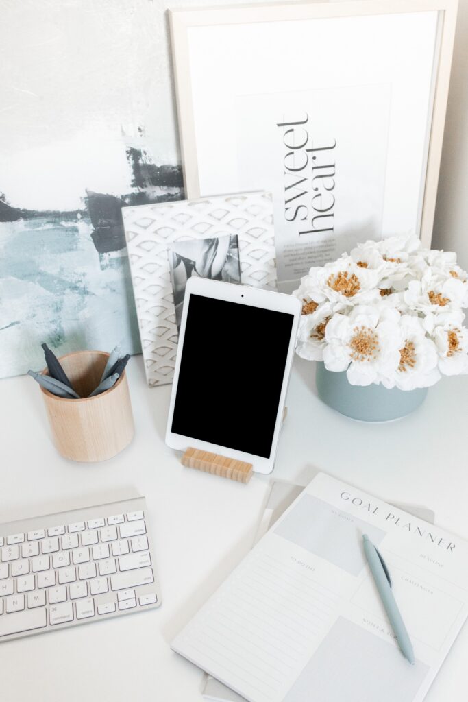 An Extensive List of Resources For Bloggers - Stock photo from Girl Boss stock images of a desk with an ipad, keyboard and flowers