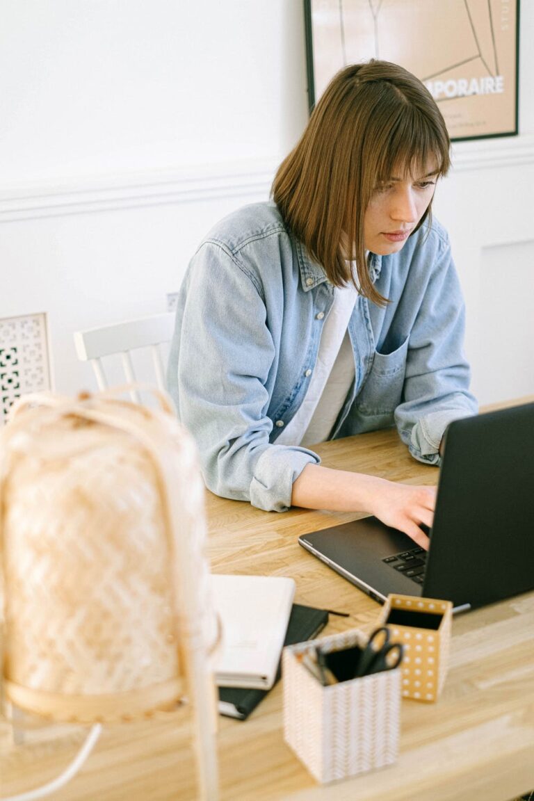 5 Bloggers you HAVE to check out - Stock photo from pexels by Ivan Samkov of a woman on a laptop
