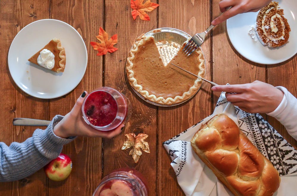 Stock photo from pexels by 
Element5 Digital of a table with autumn themed food on it such as pie and a loaf of home baked bread and some apples with autumn coloured leafs
