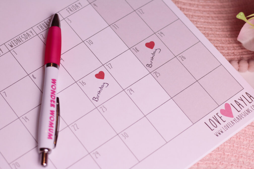 Flatlay photo of a calendar from Love Layla with Birthday written in boxes