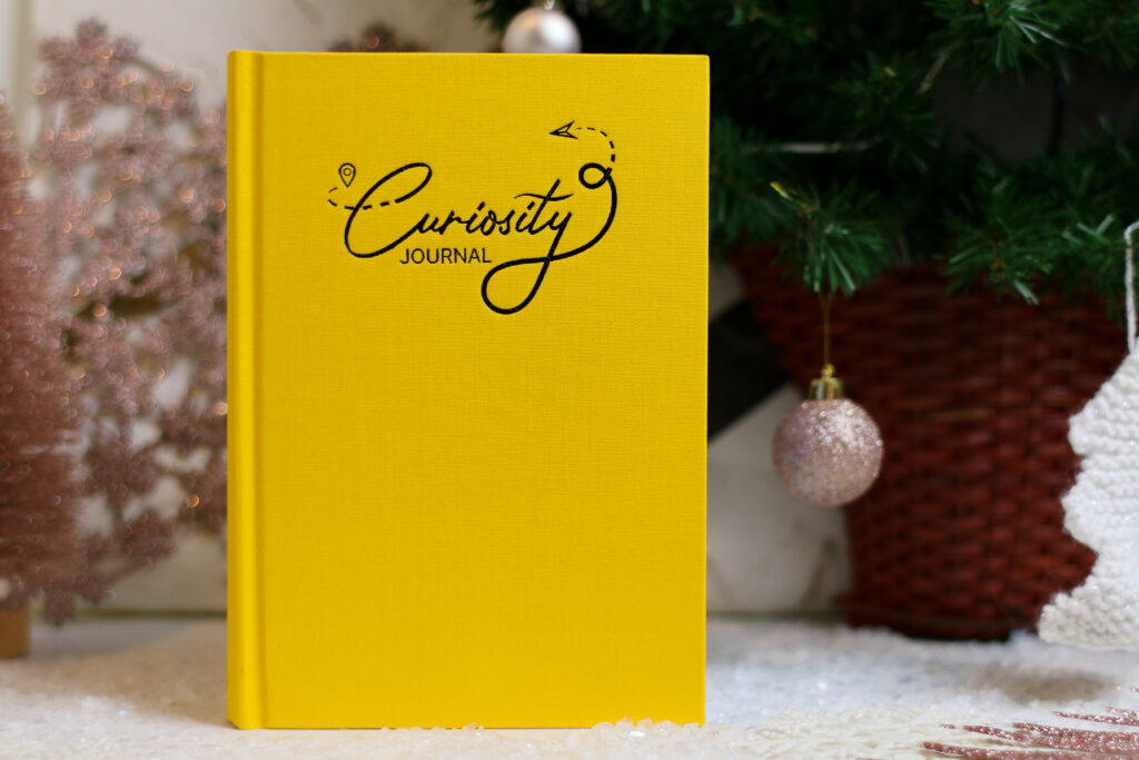 Close up photo of the Yellow Curiosity Journal