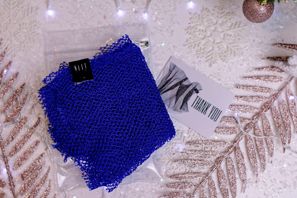 Birdseye view photo of a blue NETT exfoliator 