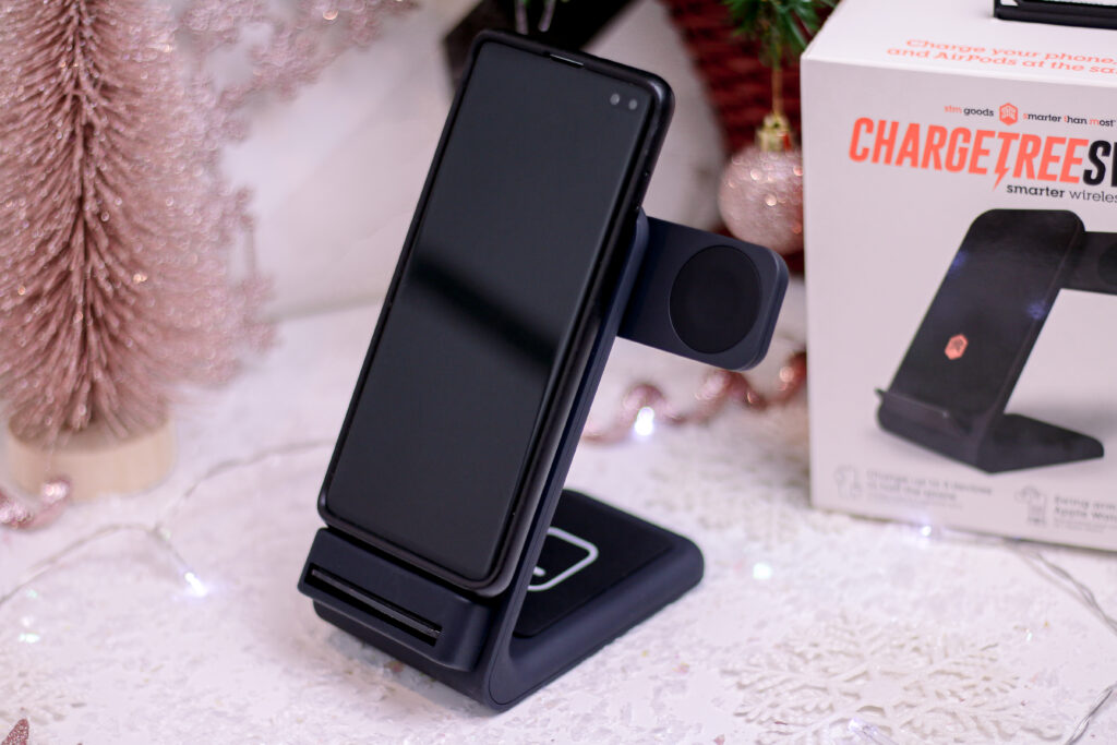 A medium close up of the ChargeTree Swing in black with a samsung phone getting charged
