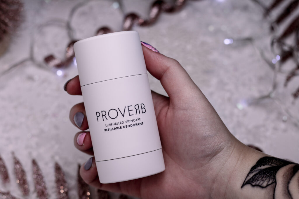 Close up photo of Jordanne holding the Proverb deodorant case