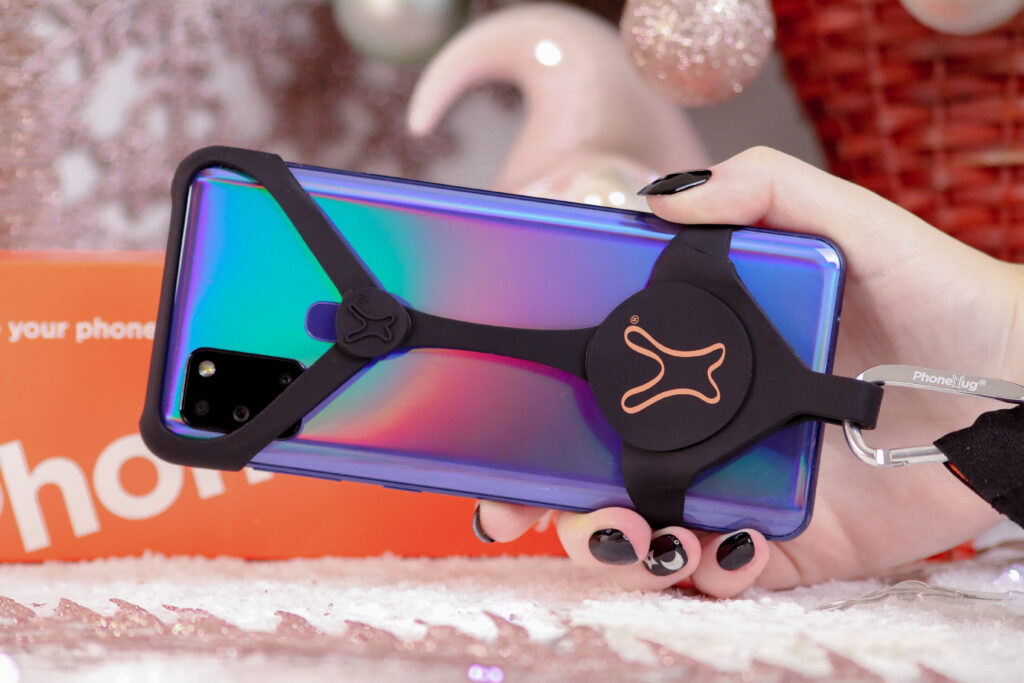 Close up photo of the PhoneHug in Black colour on a phone