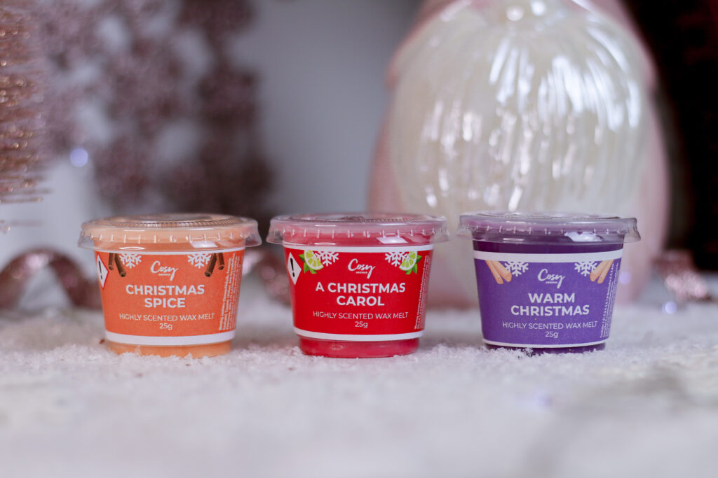 Close up of three wax melts from Cosy Aromas Christmas Mini Melt Selection Box