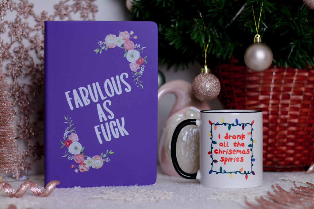 Close up photo of a mug and notebook from Love Layla