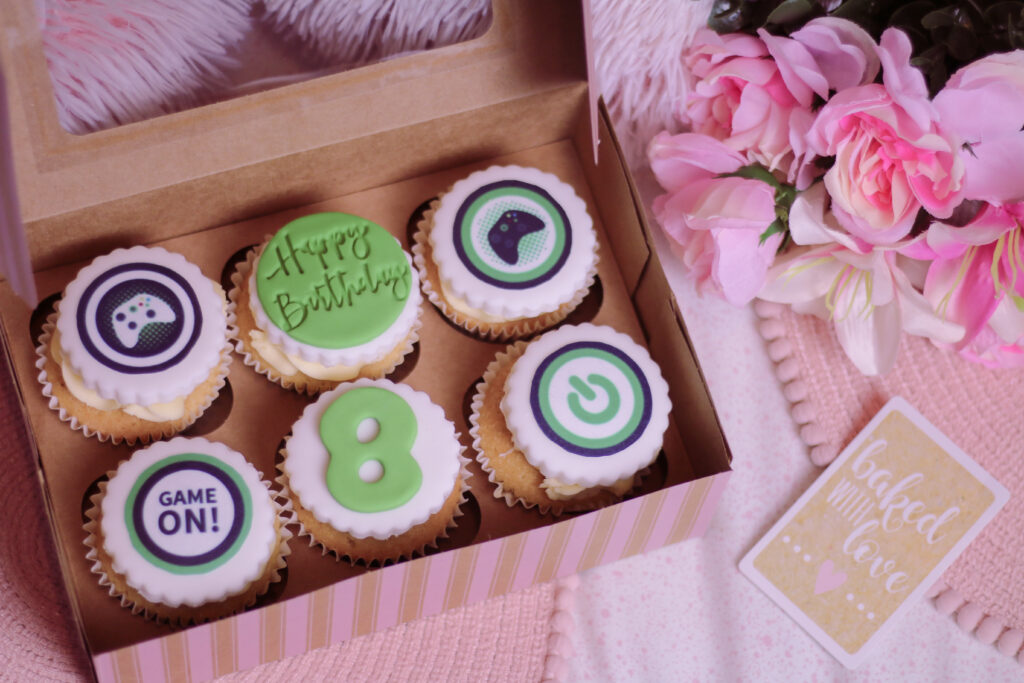 Photo of 6 personalised gamer birthday cupcakes