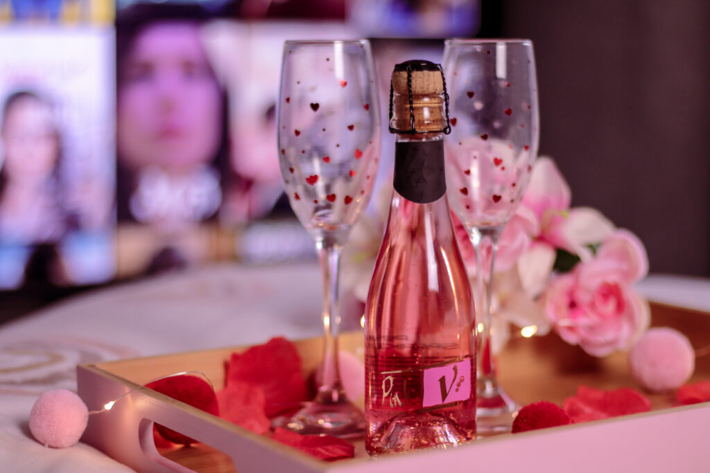 A medium close up of a mini bottle of pink vodka from IL Gusto