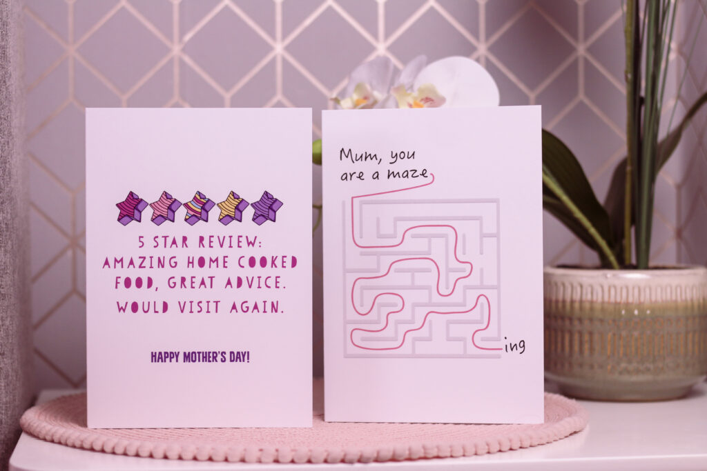 Close up of two Mother's Day cards from Love Layla Designs. The first card reads""5 star review: Amazing home cooked food, great advice. would visit again" The Second Card reads "Mum, you are a maze-ing" with a drawing of a maze