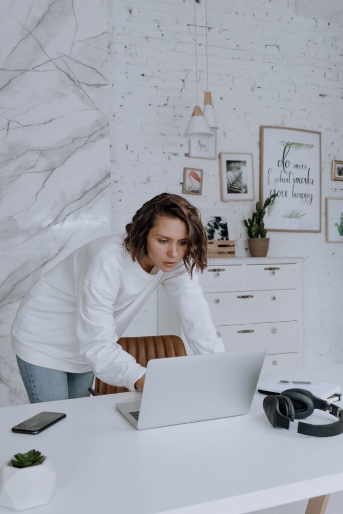 Stock photo from pexels by cottonbro of a Woman in White Long Sleeve Shirt Sitting on Chair