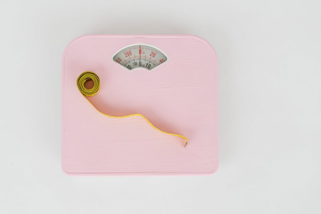 A stock photo from Pexels by SHVETS production of pink bathroom scales