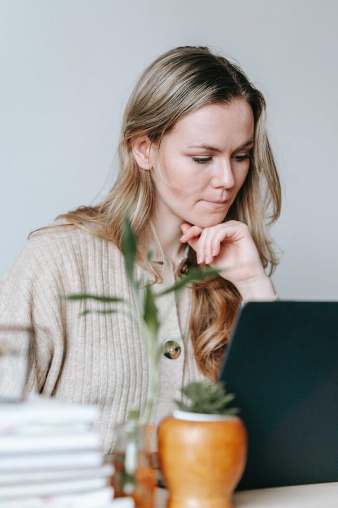 Stock photo from Pexels by George Milton of a woman looking at a laptop