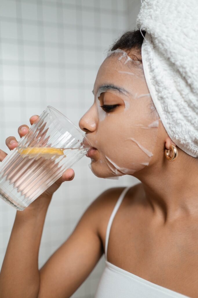Stock photo from pexels by Ron Lach of Woman Drinking Water With Lemon practicing Self-Care