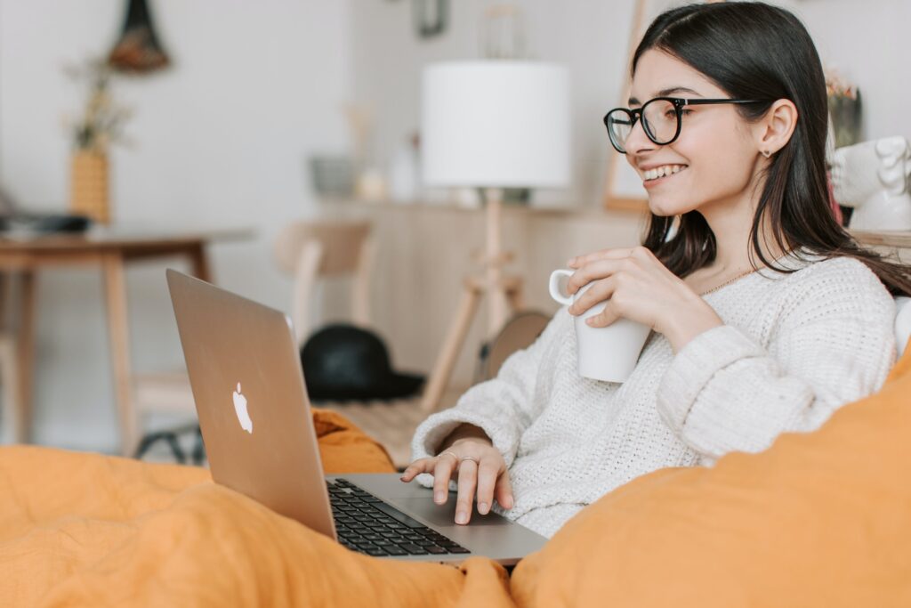 Stock photo from pexels by Vlada Karpovich of a Woman Having Coffee While Using Laptop
