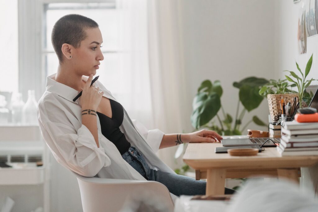 stock photo from pexels by George Milton of a Pensive woman working on laptop at desk