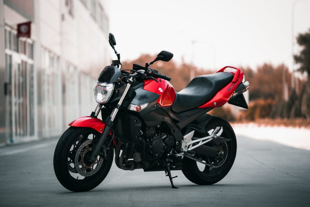 Photo from Pexels by Jakub Sisulak of a red Motor Bike