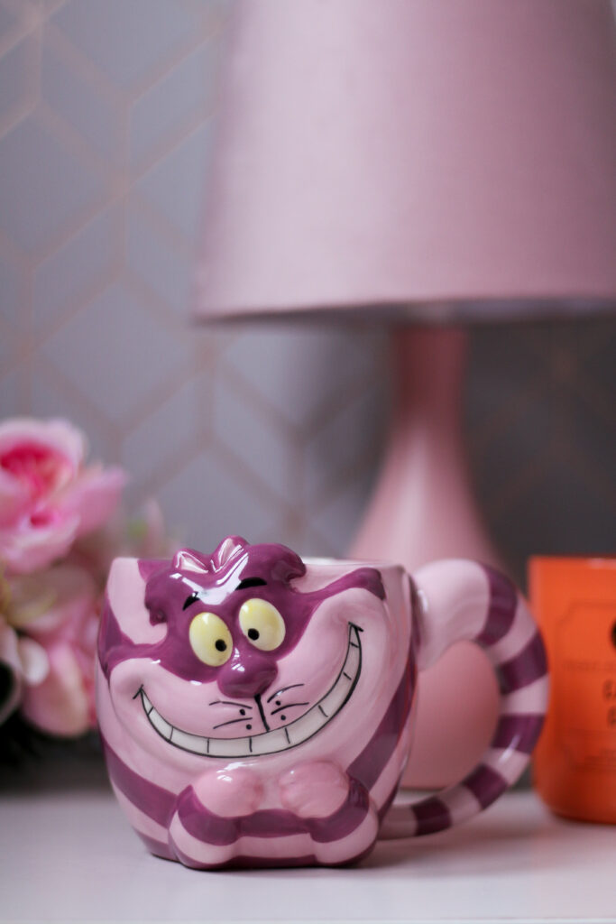 Close up of an Alice in Wonderland cheshire cat mug