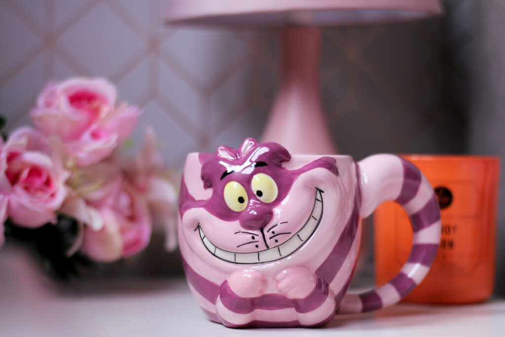 Close up of an Alice in Wonderland cheshire cat mug