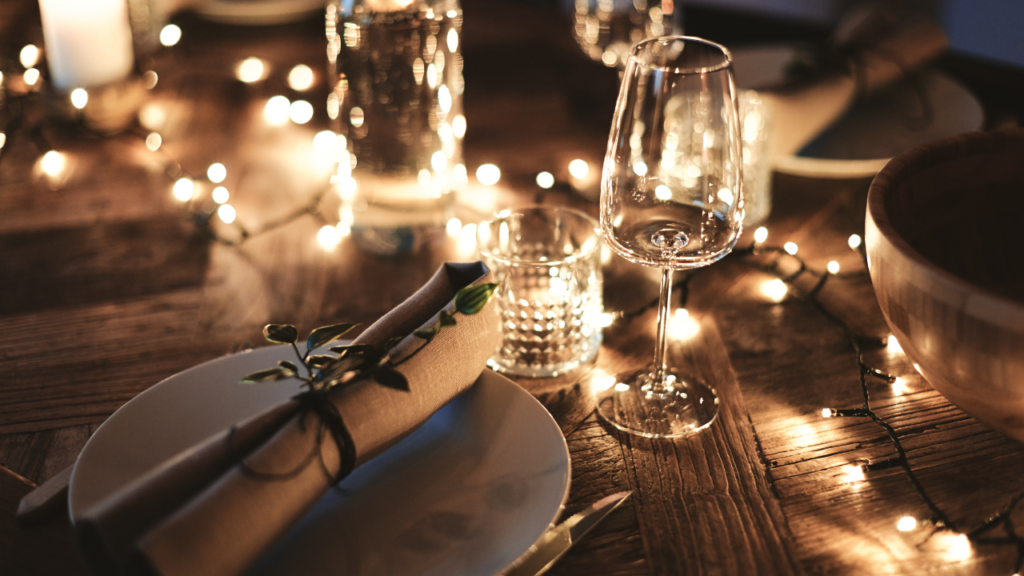 Stock photo from Canva by StefanDahl of a candle lit dinner table