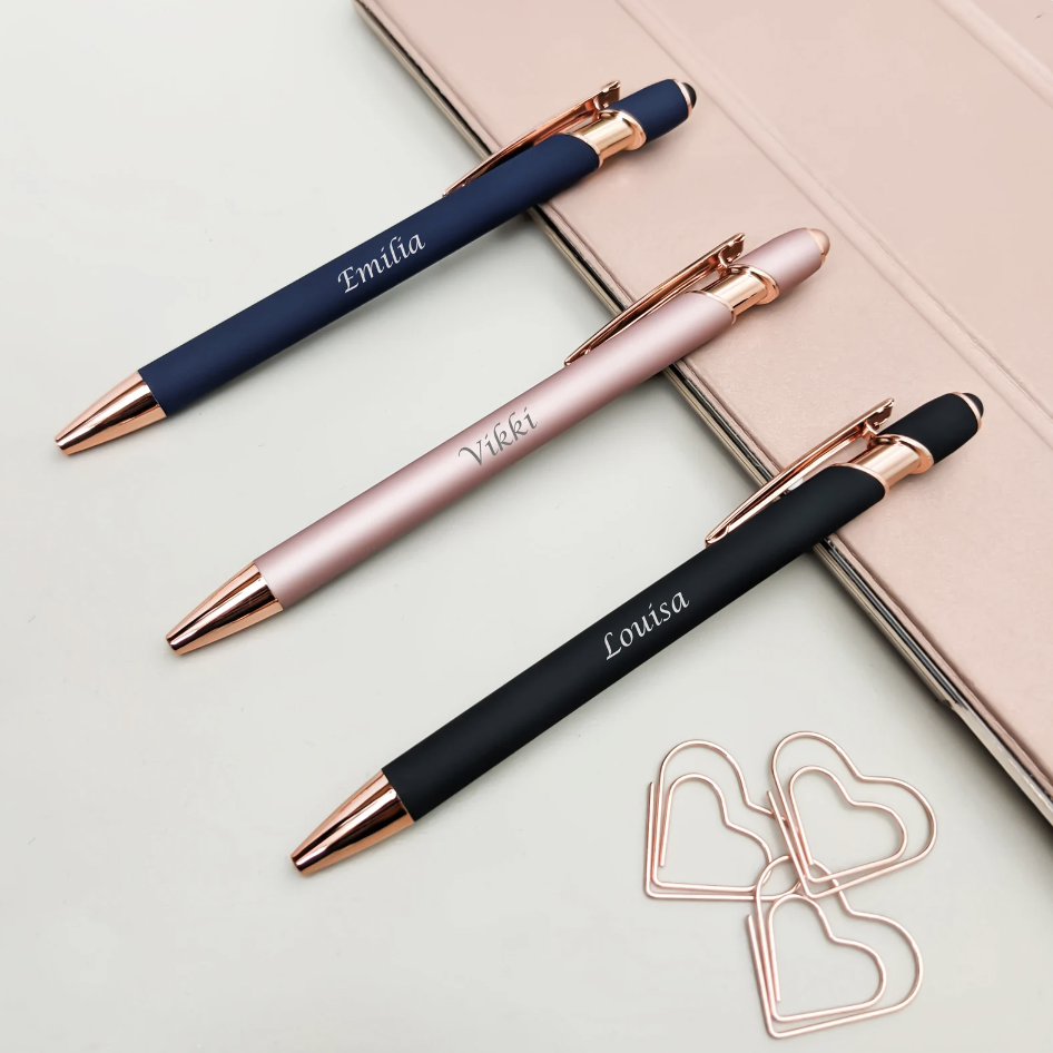 Photo by GIFTARU on Etsy of three pens that have been personalised with a name