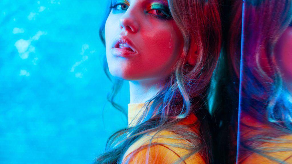 Stock photo from Canva by Magnilion at Getty Images of a fashion model in neon lights