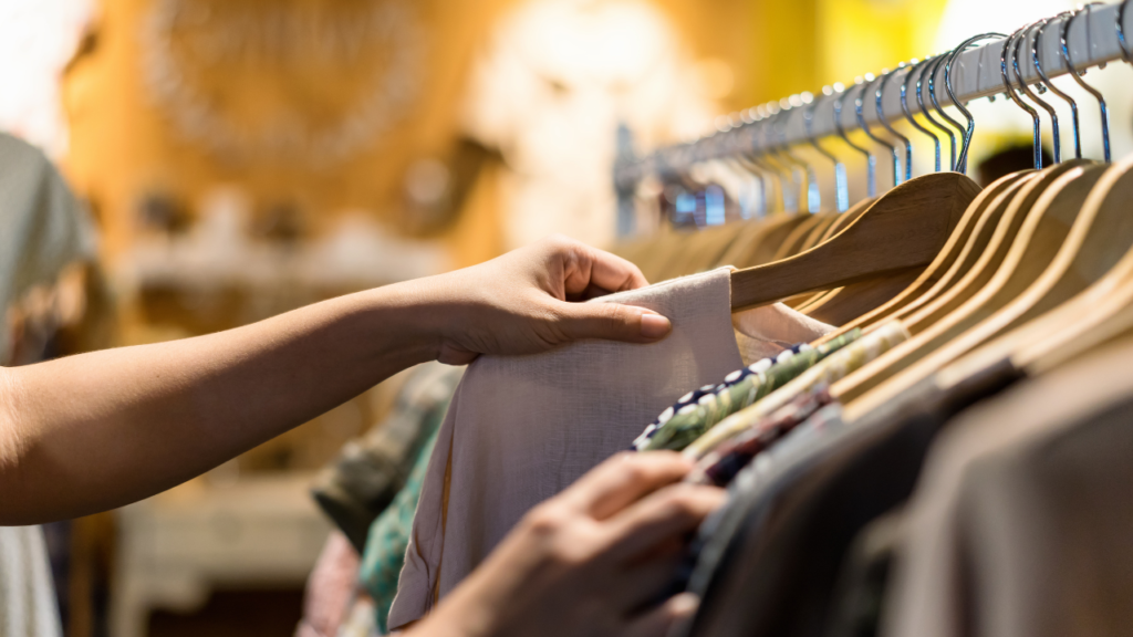 Stock photo from Canva by Chaay_Tee at Getty Images of a woman shopping in a thrift store
