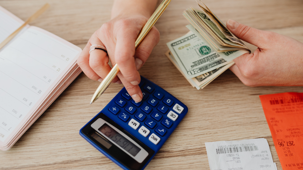 Stock photo from Canva of a woman calculating money