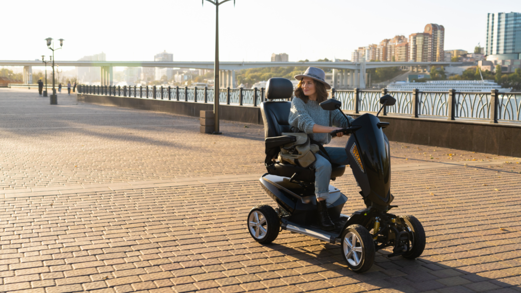 Stock photo from Canva by Scharfsinn86 at Getty Images of a woman sitting on a mobility scooter on a pier