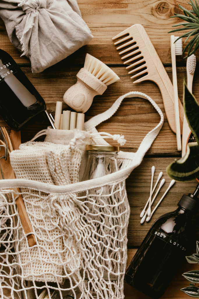 Stock photo from Canva by Natalia Klenova of sustainable products on a dark wood table